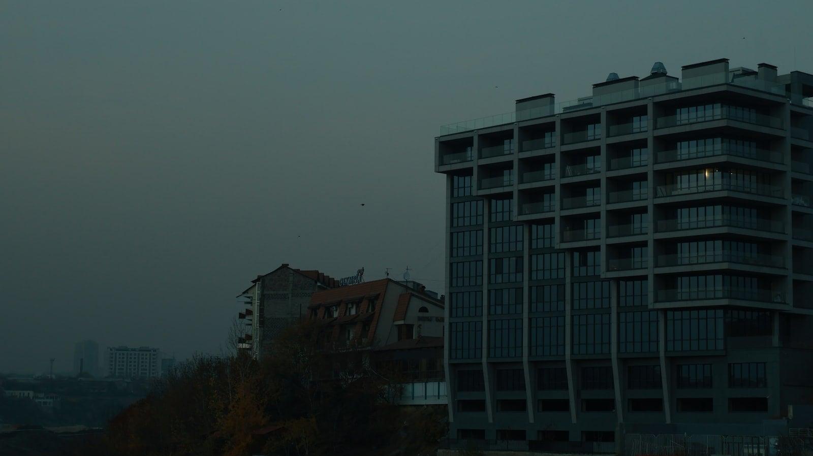 Modern building against a dark, overcast sky