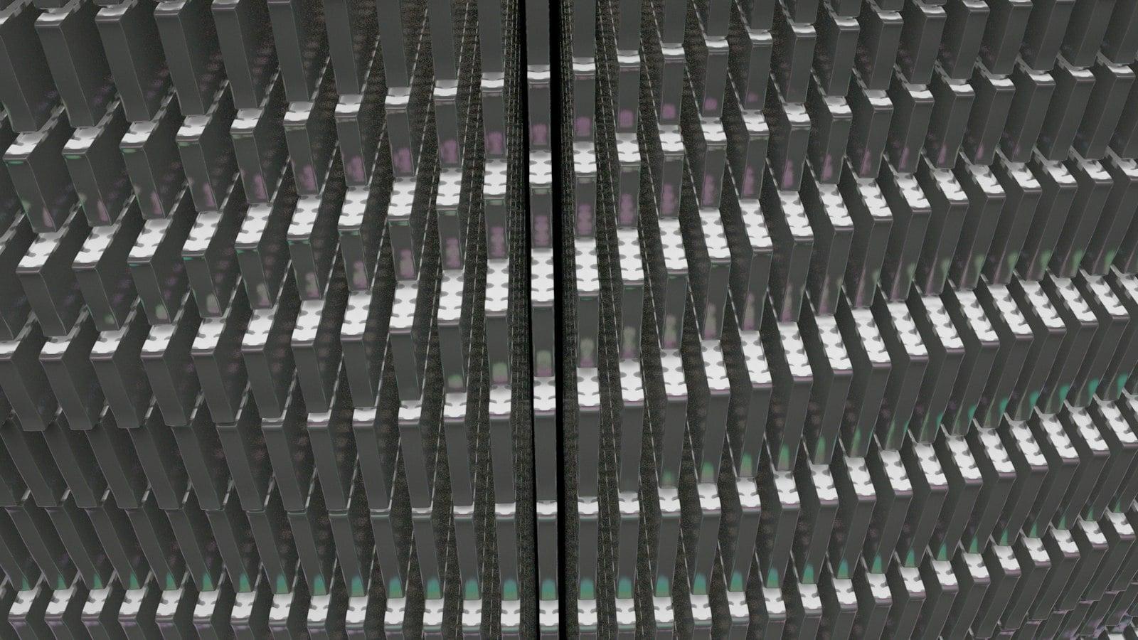 A 3D render of a dense grid of dark rectangular server blades in a data center
