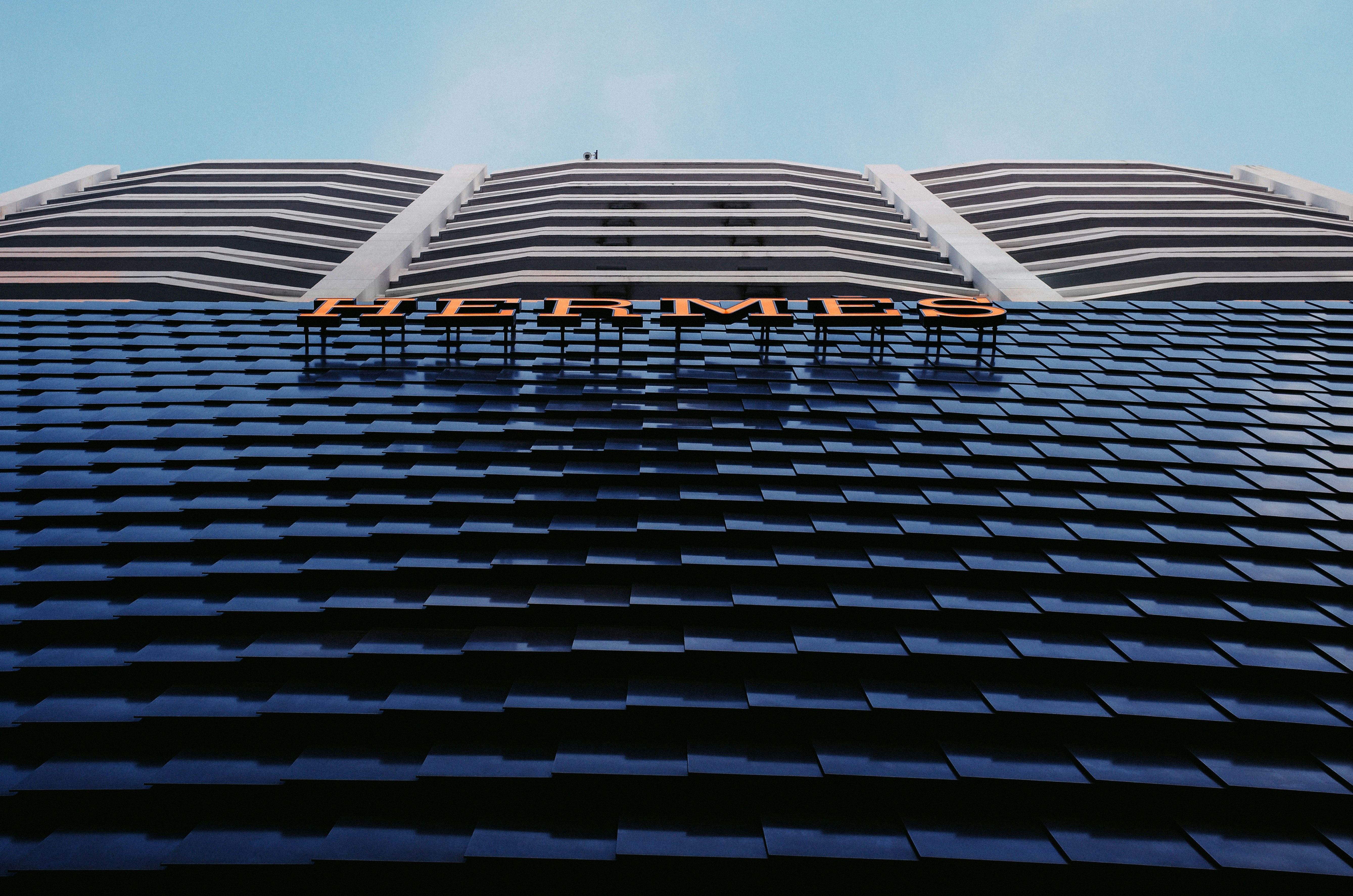 A tall building with a sign on top of it